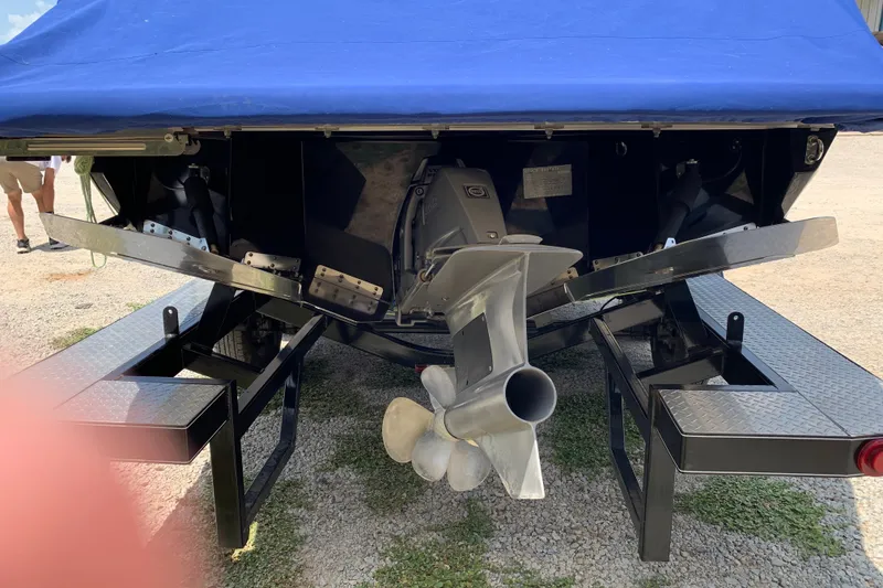 Slide: The Image of Rear view of a 2020 Regal LS6 Surf boat with covered propeller and trailer. - 71