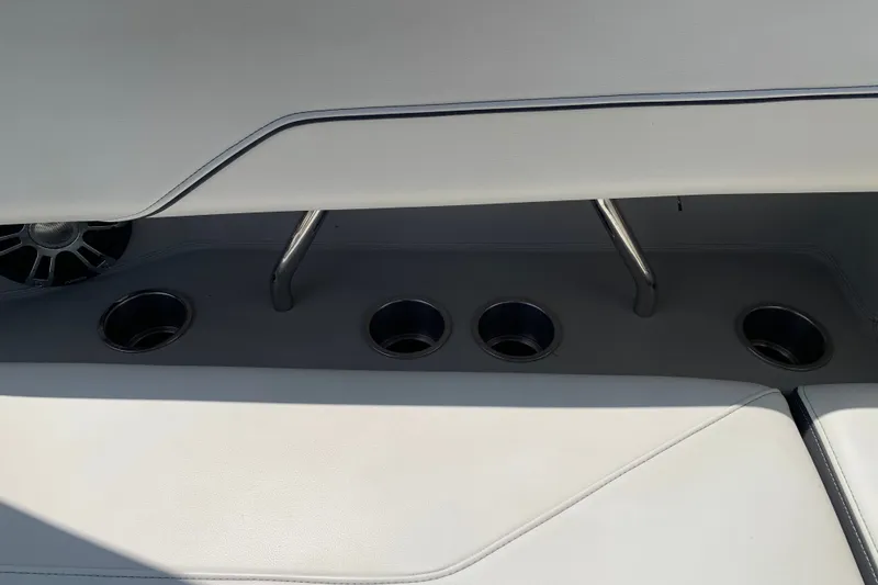 Slide: The Image of Interior of 2020 Regal LS6 Surf boat with cup holders and speaker. - 55