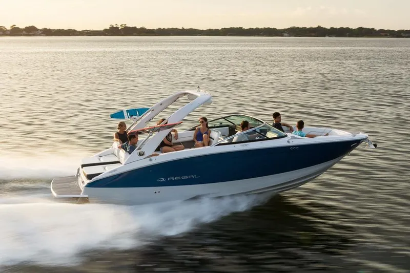 Slide: The Image of Manufacturer Provided Image: 2020 Regal LS6 Surf boat cruising on a lake with passengers. - 83