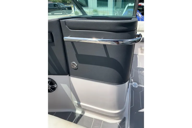 Slide: The Image of 2020 Regal LS6 Surf boat interior detail with sleek black and white design. - 34