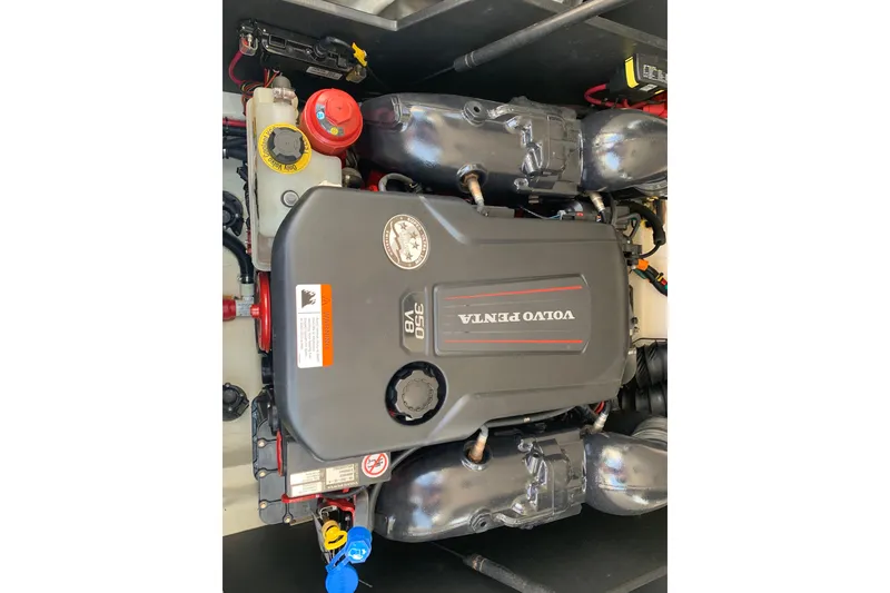 Slide: The Image of Volvo Penta engine in a 2020 Regal LS6 Surf boat, showcasing the 350 V8 model. - 62