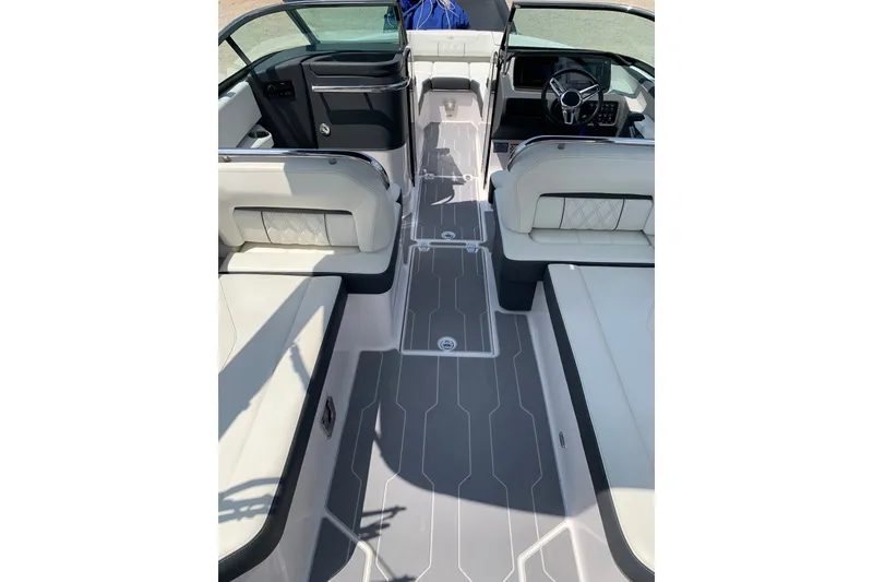 Slide: The Image of 2020 Regal LS6 Surf boat interior with sleek seating and modern dashboard design. - 17