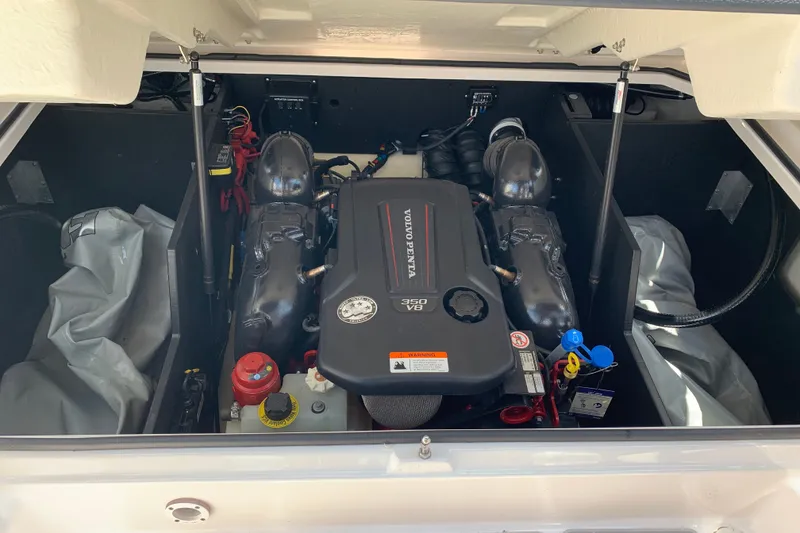 Slide: The Image of 2020 Regal LS6 Surf boat engine compartment with Volvo Penta 350 V8 engine. - 59