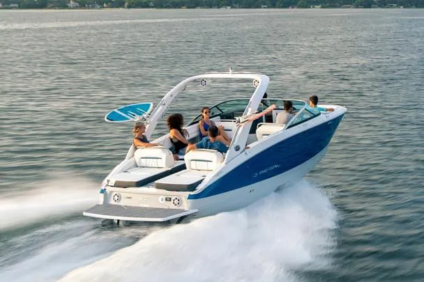 Slide: The Image of Manufacturer Provided Image: 2020 Regal LS6 Surf boat cruising on a lake with passengers. - 84