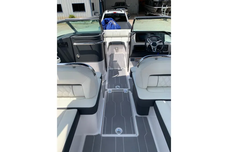Slide: The Image of 2020 Regal LS6 Surf boat interior with modern seating and sleek dashboard design. - 18