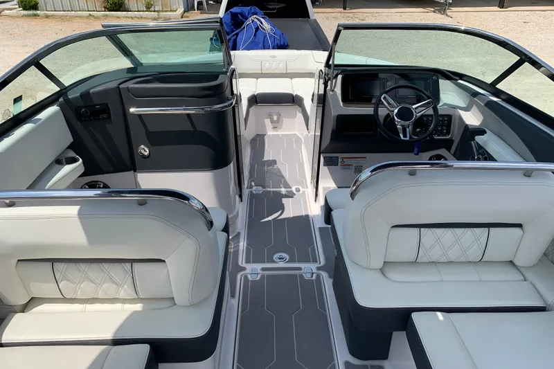 Slide: The Image of 2020 Regal LS6 Surf boat interior with luxurious seating and modern dashboard design. - 7