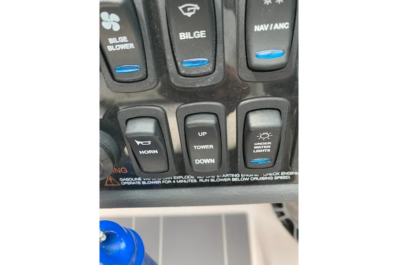 Slide: The Image of Control panel of a 2020 Regal LS6 Surf boat with various switches. - 65