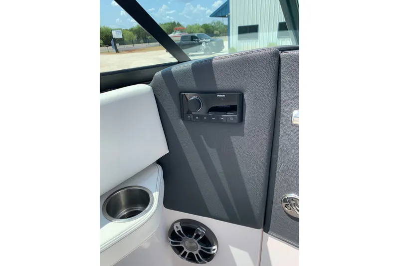 Slide: The Image of Interior of 2020 Regal LS6 Surf boat featuring audio controls and speaker. - 35