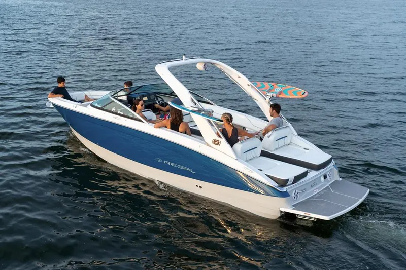 Slide: The Image of Manufacturer Provided Image: 2020 Regal LS6 Surf boat cruising with passengers on a lake. - 89