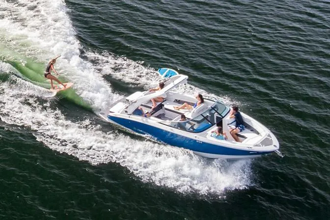 Slide: The Image of Manufacturer Provided Image: 2020 Regal LS6 Surf boat towing a wakeboarder on a sunny day. - 85