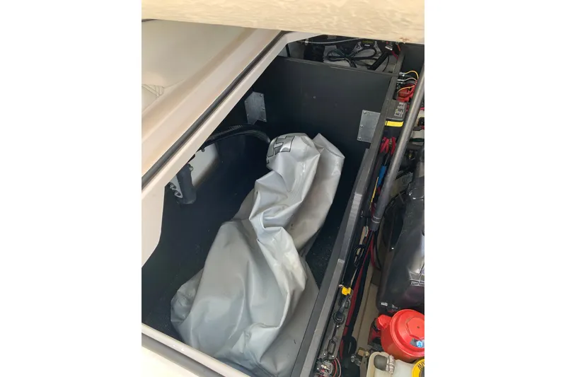 Slide: The Image of 2020 Regal LS6 Surf boat storage compartment with equipment and wiring. - 57