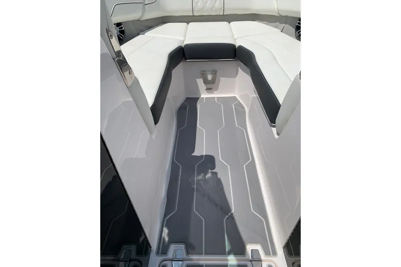 Slide: The Image of 2020 Regal LS6 Surf boat interior with sleek seating and modern flooring design. - 44