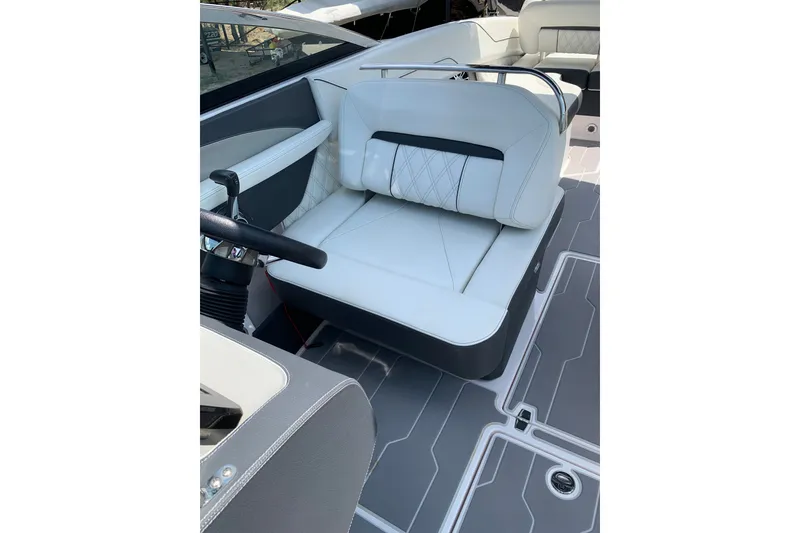 Slide: The Image of 2020 Regal LS6 Surf boat interior with white seating and modern design. - 26