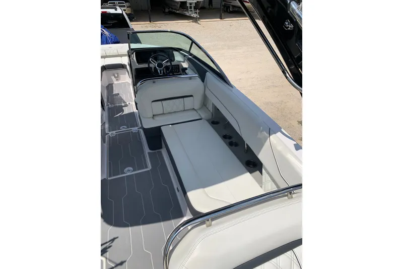 Slide: The Image of 2020 Regal LS6 Surf boat interior with sleek seating and modern dashboard design. - 16