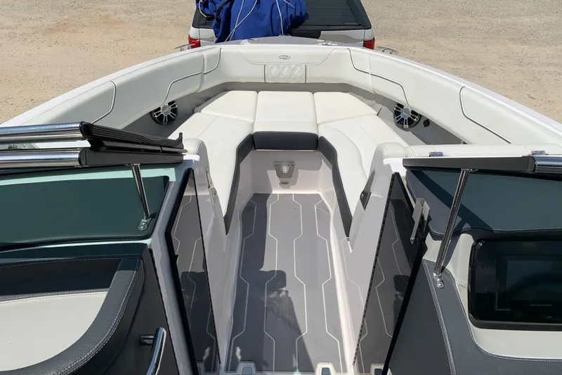 Slide: The Image of 2020 Regal LS6 Surf boat interior with white seating and modern design. - 12