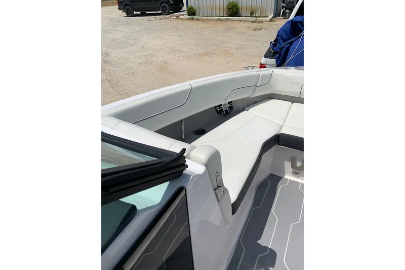 Slide: The Image of 2020 Regal LS6 Surf boat interior with white seating and modern design. - 21