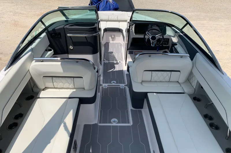Slide: The Image of 2020 Regal LS6 Surf boat interior with luxurious seating and modern dashboard design. - 10