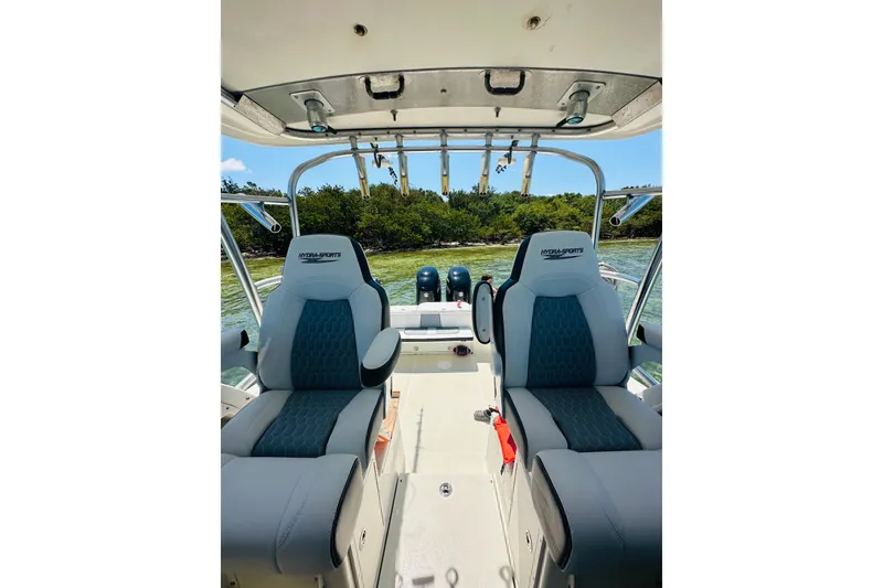 Slide: The Image of 2002 Hydra-Sports Vector 2800 WA boat interior with dual seats and scenic water view. - 1