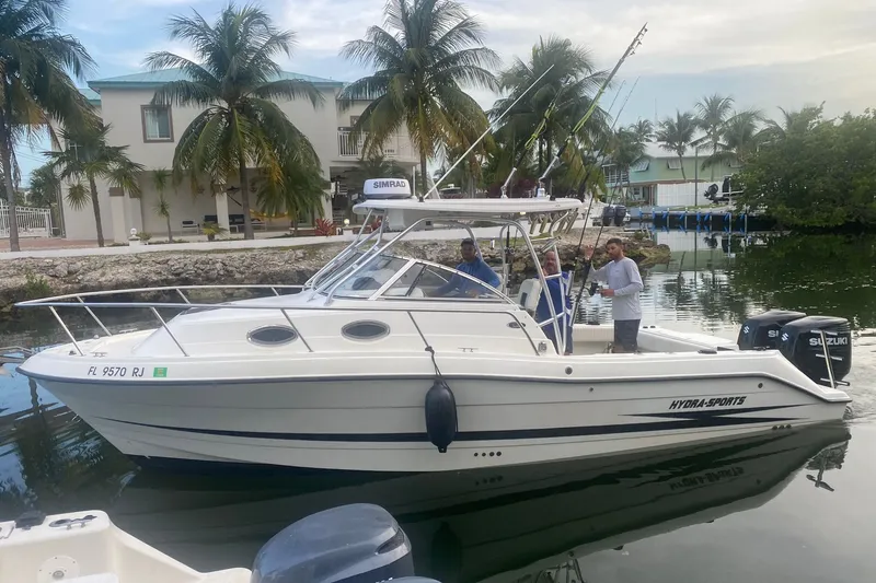 The Image of 2002 Hydra-Sports Vector 2800 WA boat docked near palm trees. - 0