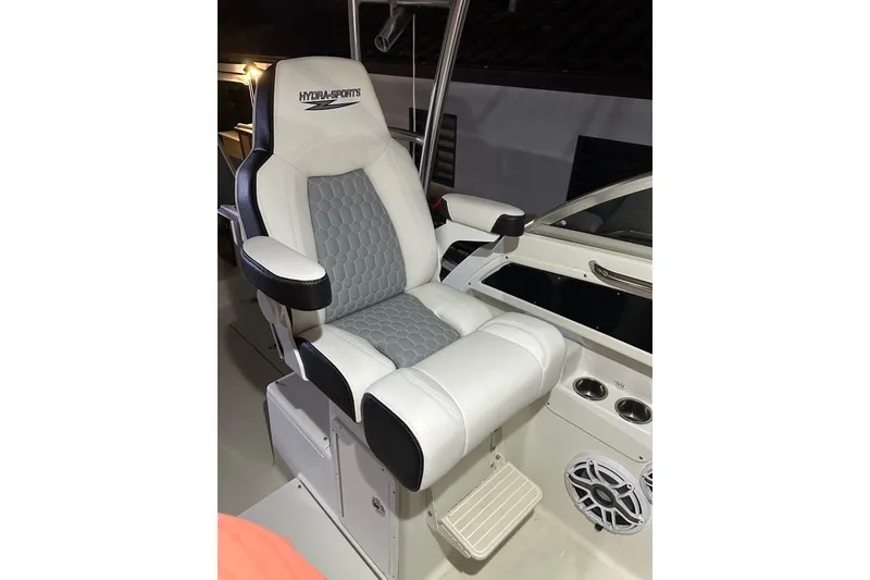 Slide: The Image of Captain's chair on 2002 Hydra-Sports Vector 2800 WA boat, featuring white and gray upholstery. - 2