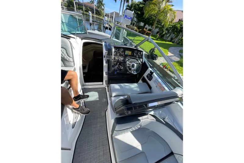 Slide: The Image of 2017 Monterey 295 Sport Yacht cockpit with modern dashboard and comfortable seating. - 20