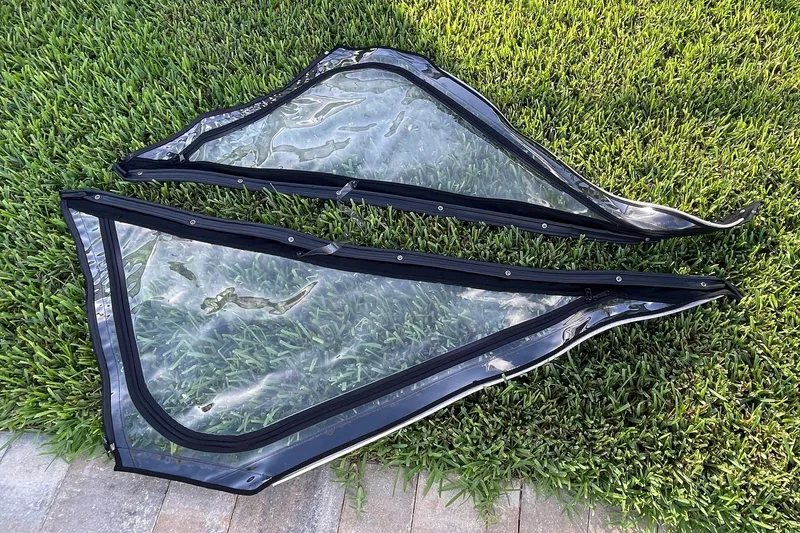 Slide: The Image of Clear plastic boat windows for 2017 Monterey 295 Sport Yacht on grass. - 25