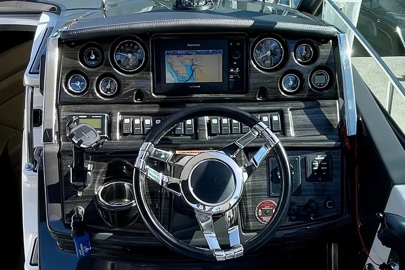 Slide: The Image of Dashboard of a 2017 Monterey 295 Sport Yacht with navigation and control instruments. - 21