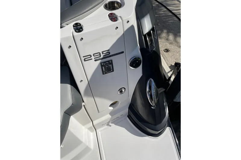 Slide: The Image of 2017 Monterey 295 Sport Yacht interior detail with control panel and seating. - 16