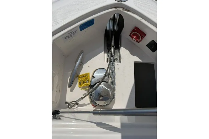 Slide: The Image of Anchor compartment of 2023 Regal 29 OBX boat with chain and cleat. - 28