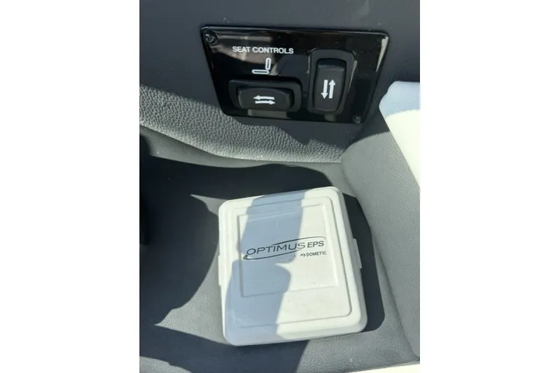 Slide: The Image of 2023 Regal 29 OBX seat controls and Optimus EPS system by Dometic. - 11