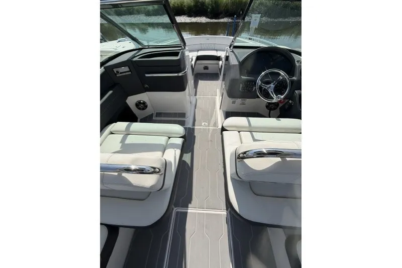 Slide: The Image of Interior view of 2023 Regal 29 OBX boat, featuring sleek seating and modern dashboard. - 22