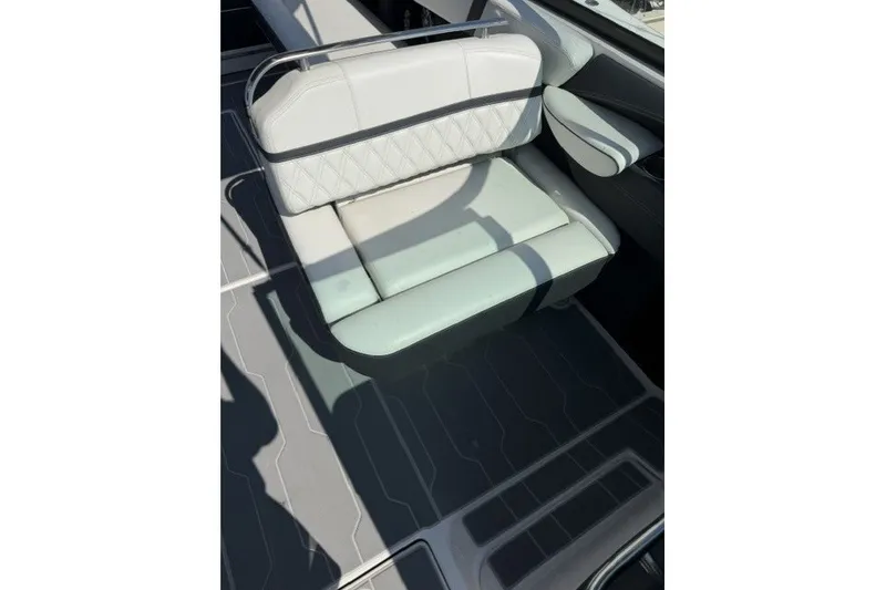 Slide: The Image of 2023 Regal 29 OBX boat seat with quilted upholstery and armrest. - 13