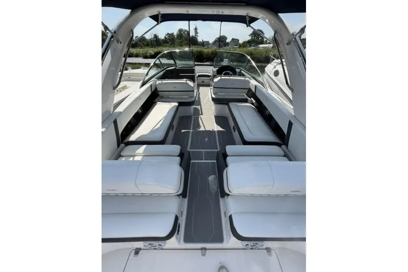 Slide: The Image of 2023 Regal 29 OBX boat interior with luxurious white seating and modern design. - 21