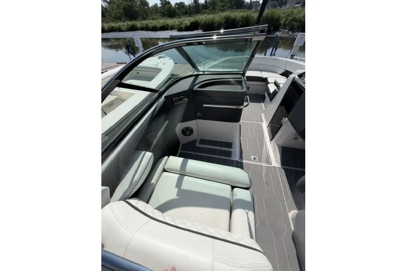 Slide: The Image of 2023 Regal 29 OBX boat interior with sleek seating and modern design. - 26