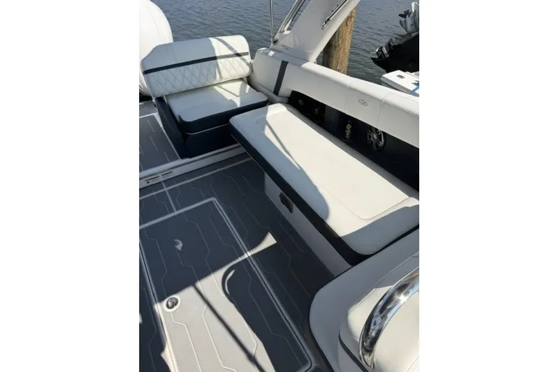 Slide: The Image of 2023 Regal 29 OBX boat interior with luxurious seating and modern design. - 30