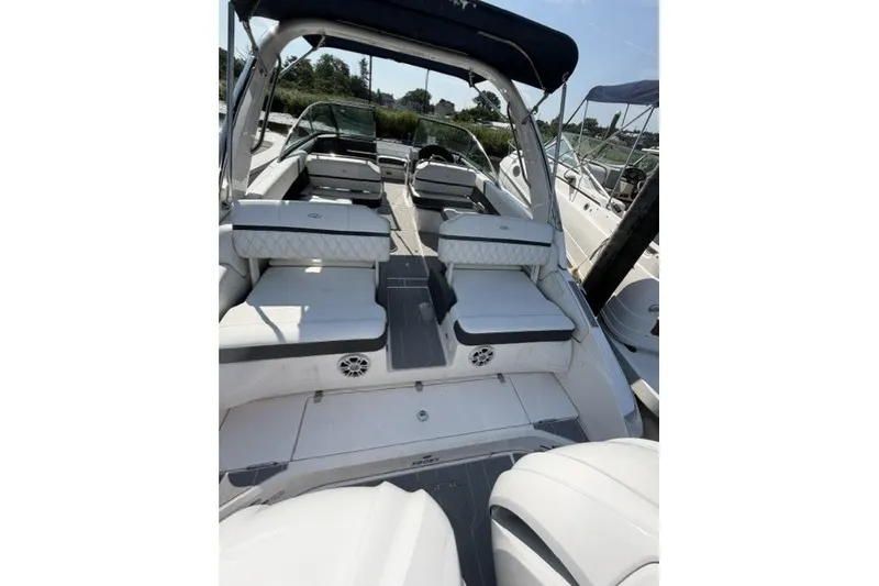 Slide: The Image of 2023 Regal 29 OBX boat interior with luxurious seating and sleek design. - 19