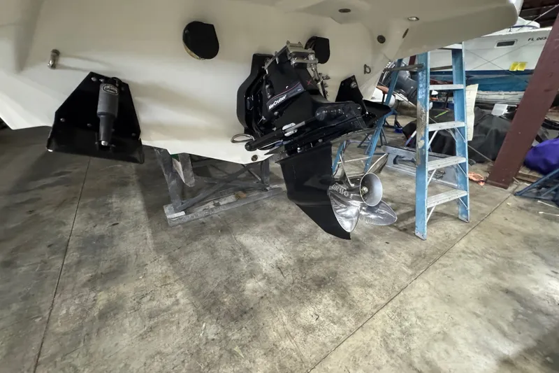 Slide: The Image of 2009 Baja 24 H2X Boss boat with visible propeller and maintenance setup. - 28