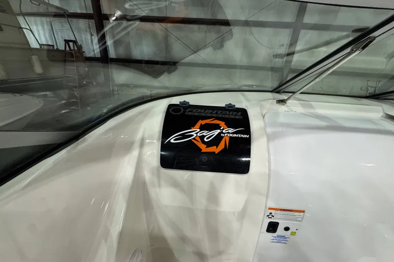 Slide: The Image of 2009 Baja 24 H2X Boss boat dashboard with logo and windshield. - 39
