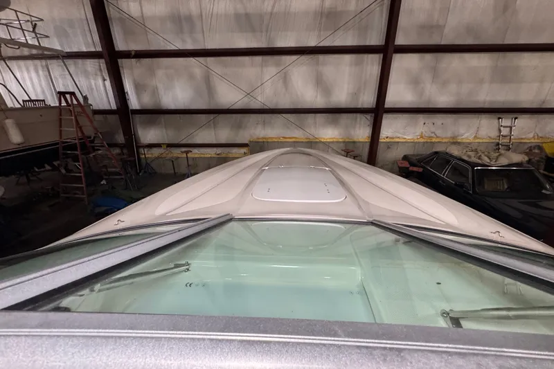 Slide: The Image of 2009 Baja 24 H2X Boss boat in storage, viewed from above. - 31