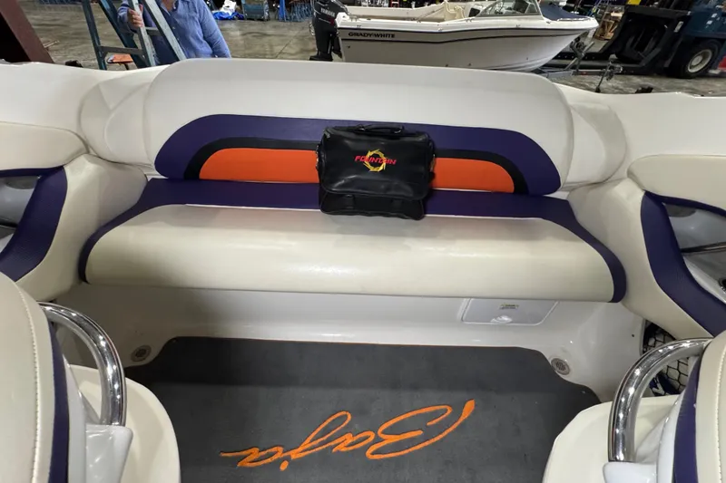 Slide: The Image of Interior of a 2009 Baja 24 H2X Boss boat with stylish seating and branded carpet. - 36