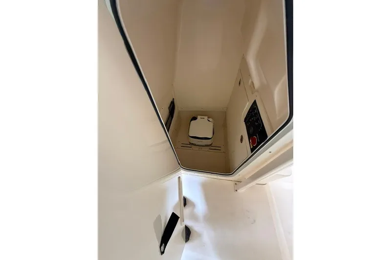 Slide: The Image of Interior view of 2020 Scout 215 XSF boat compartment with control panel. - 13