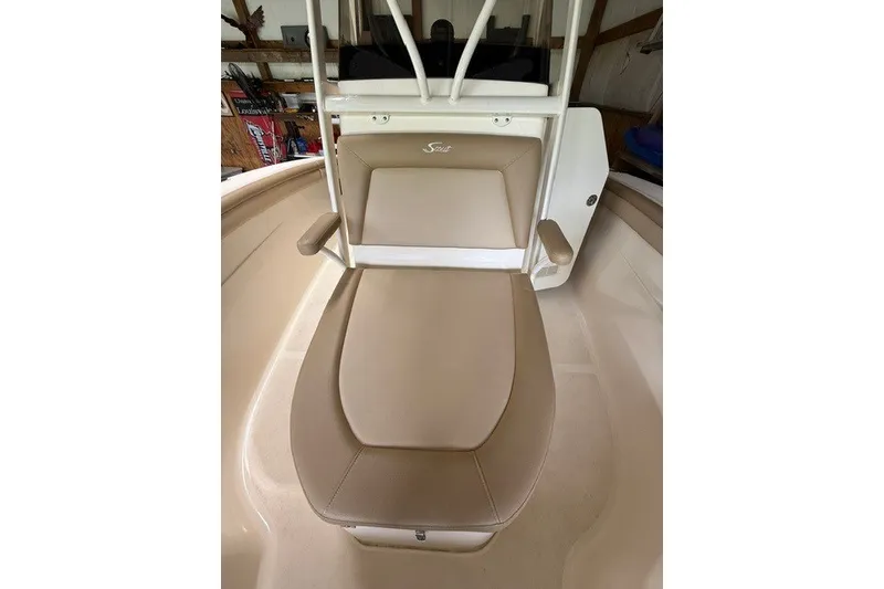 Slide: The Image of 2020 Scout 215 XSF boat seat with beige upholstery and armrests. - 15