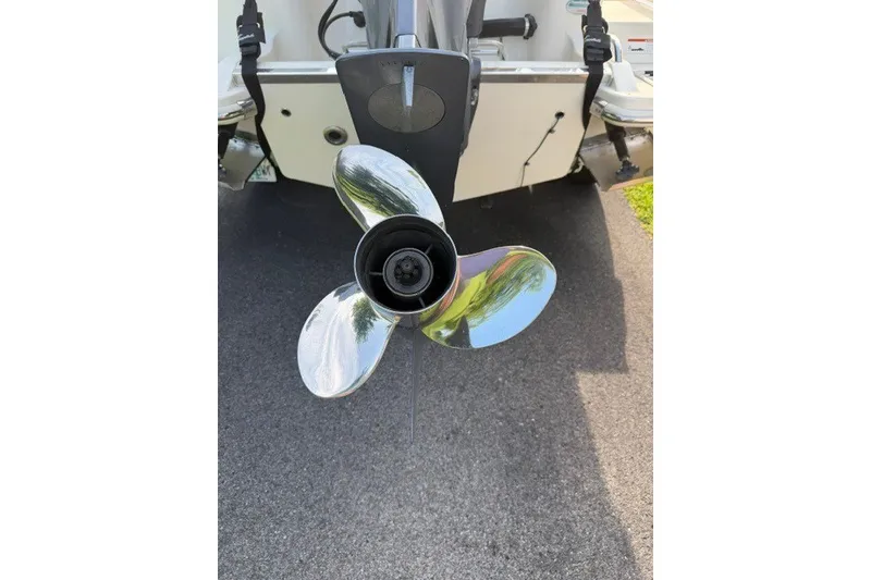 Slide: The Image of 2020 Scout 215 XSF boat propeller on pavement background. - 24