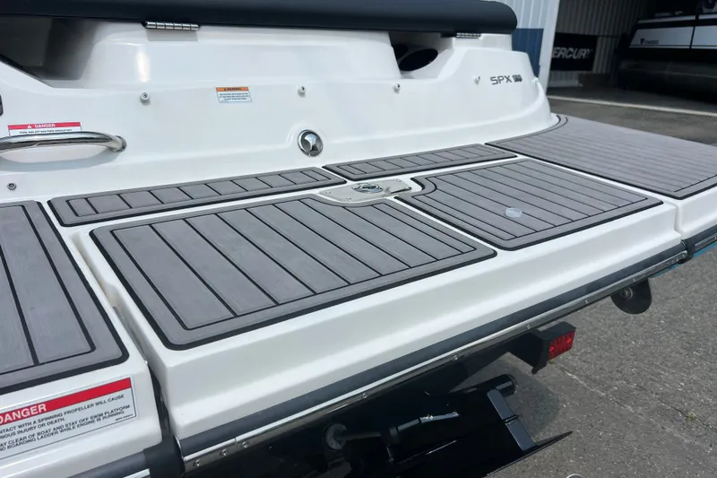 Slide: The Image of 2023 Sea Ray SPX 190 boat swim platform with sleek gray decking. - 4