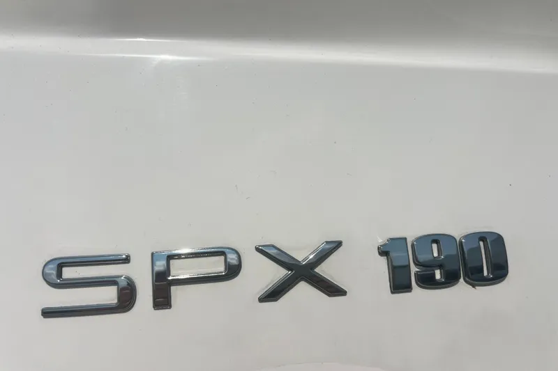 Slide: The Image of 2023 Sea Ray SPX 190 emblem on white surface, showcasing sleek design. - 17