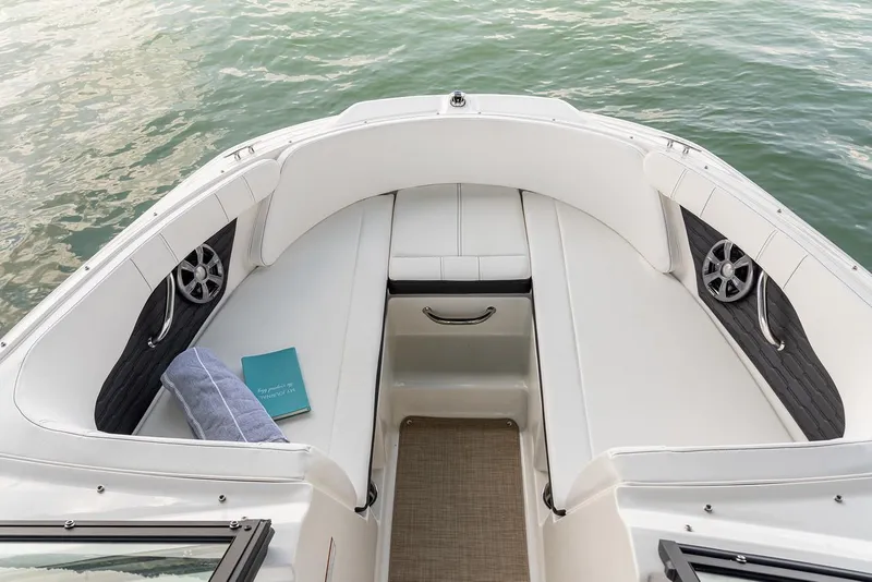 Slide: The Image of Manufacturer Provided Image: 2023 Sea Ray SPX 190 boat interior with white seating and water view. - 35