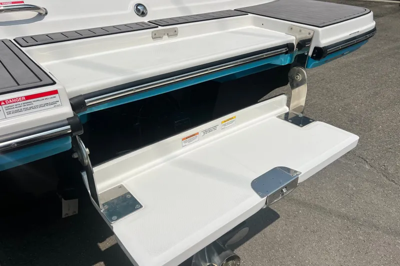 Slide: The Image of 2023 Sea Ray SPX 190 swim platform with fold-out step on a sunny day. - 5