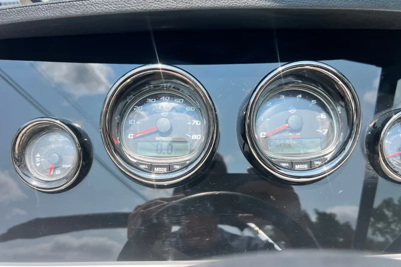 Slide: The Image of Dashboard gauges of 2023 Sea Ray SPX 190 boat, displaying speed and RPM. - 8