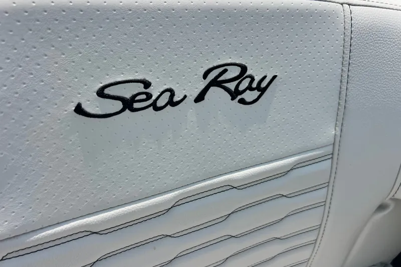 Slide: The Image of 2023 Sea Ray SPX 190 boat seat with embroidered logo on white upholstery. - 20
