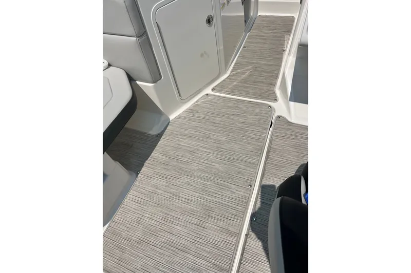 Slide: The Image of 2023 Sea Ray SPX 190 boat interior flooring with sleek, modern design and textured finish. - 19